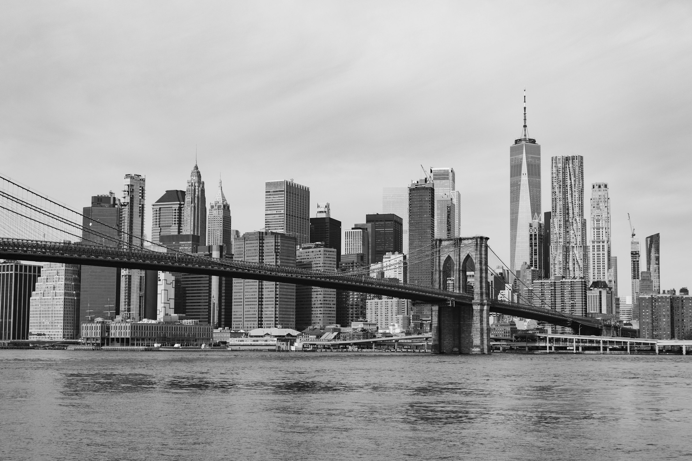 Brooklyn Bridge spanning the East River toward the Lower Manhattan skyline